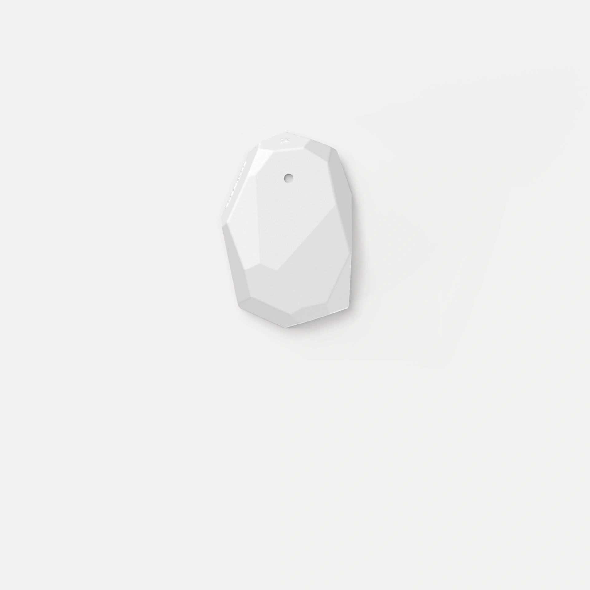 White, faceted Estimote Bluetooth beacon