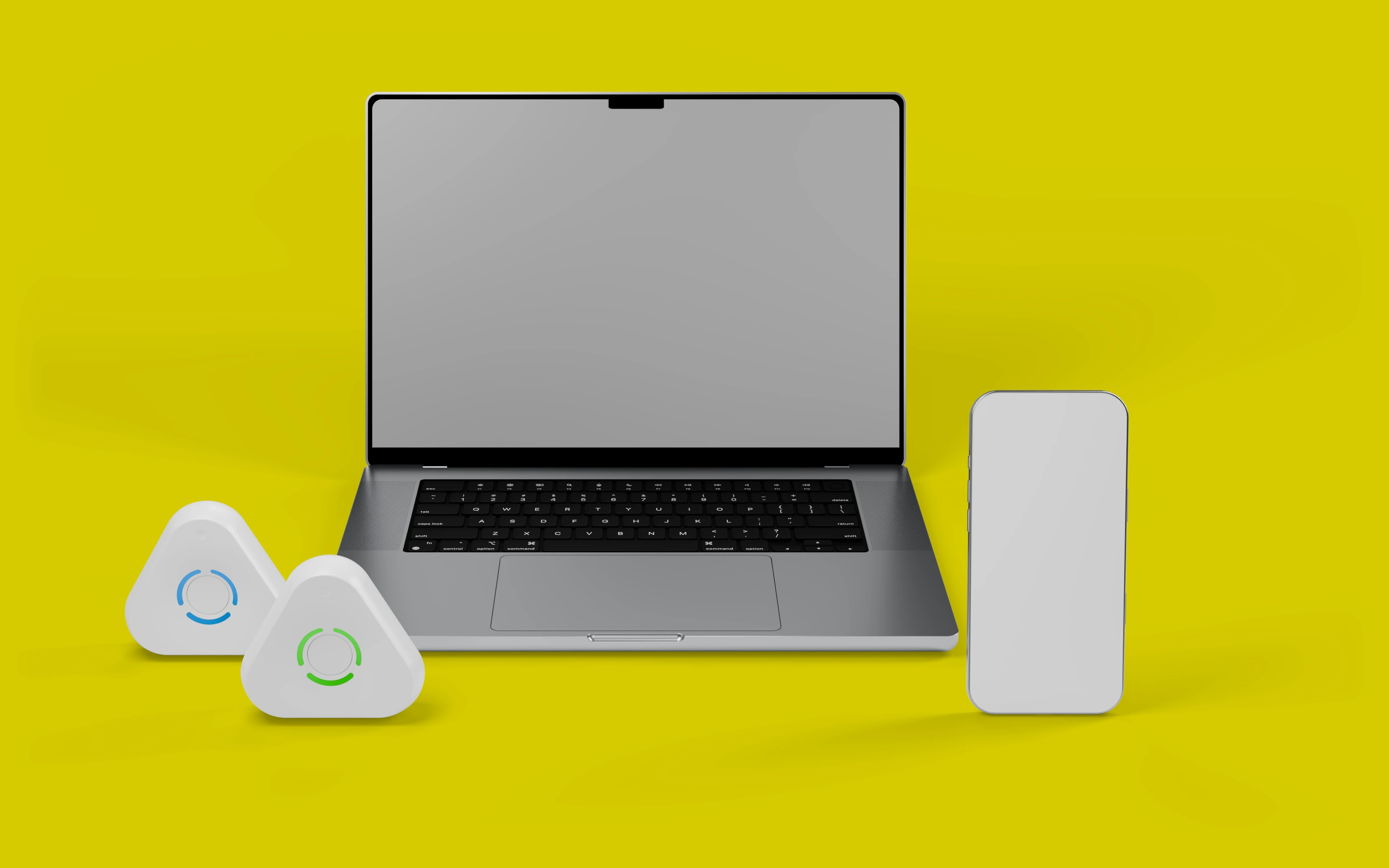 A laptop with two Estimote UWB anchors on the left and a phone on the right