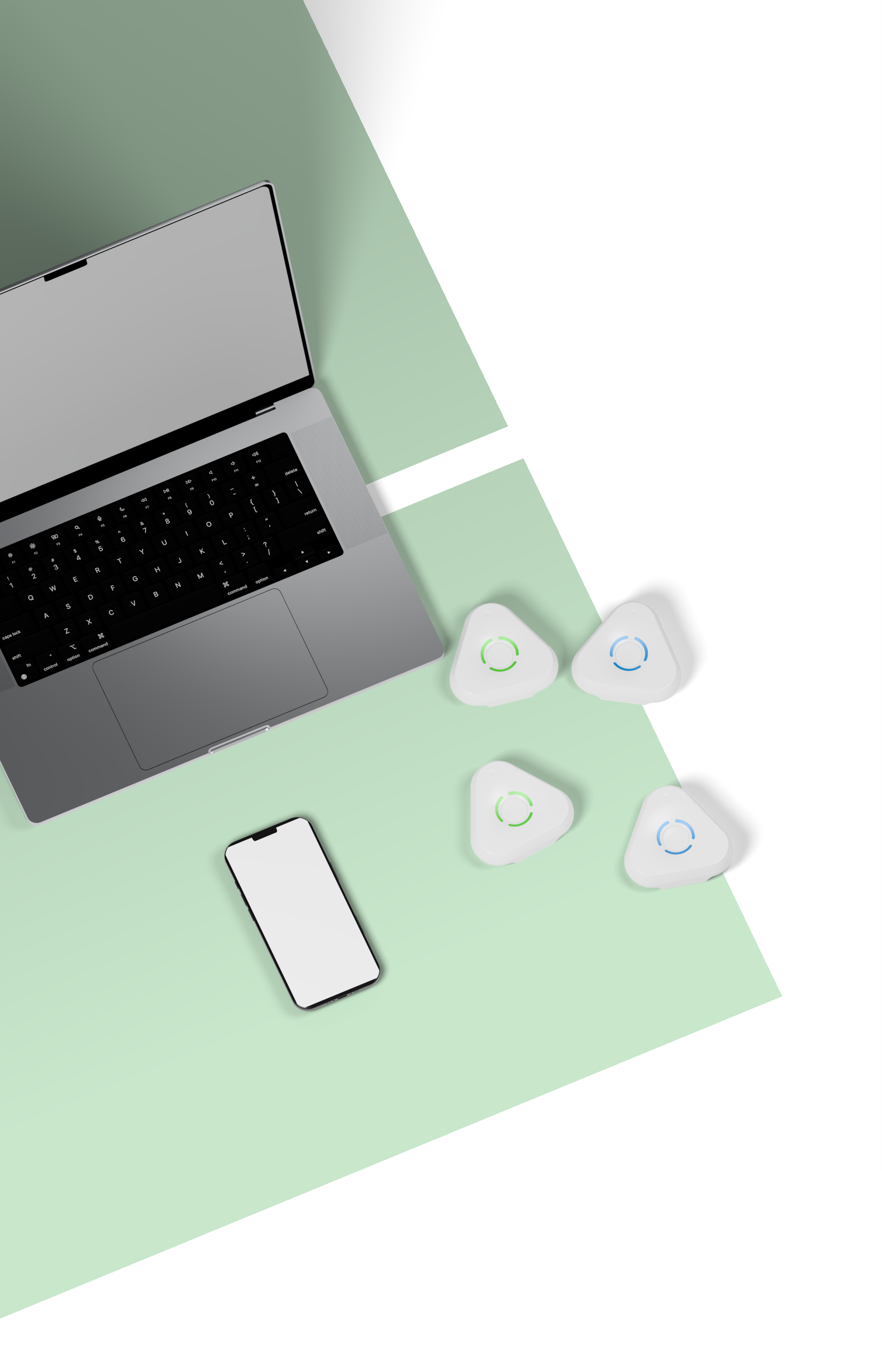 A Space Gray laptop, a black-framed phone and four lying Estimote UWB anchors on green and white panels